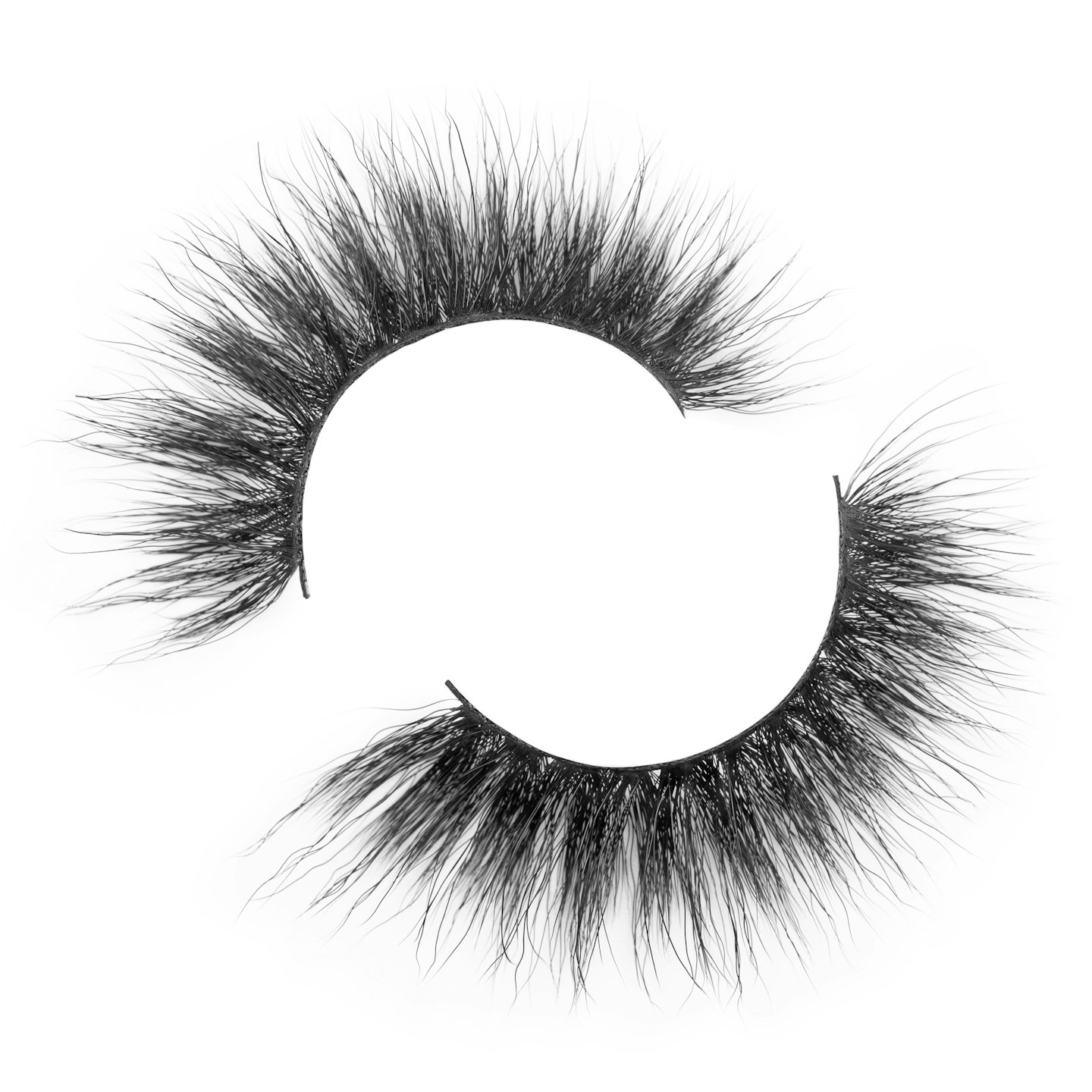 Voluminous black false eyelashes on a white background.